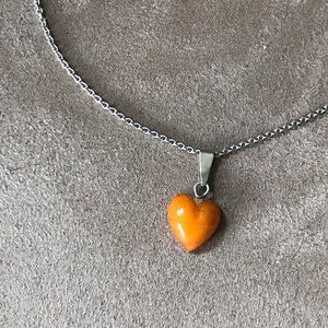 Sweet, little amber heart on silver chain